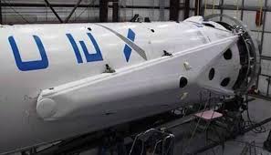 Seen stowed against the sides of the Falcon 9 v1.1, it is hoped that the four deployable landing legs will enable the vehicle's first stage to perform a gentle splashdown. Photo Credit: SpaceX