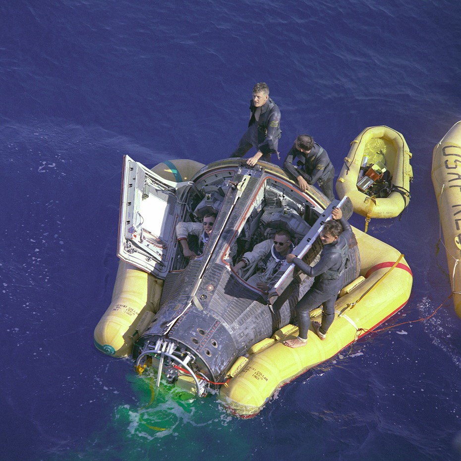 Dave Scott (left) and Neil Armstrong breathe the fresh air of Earth as the hatches of Gemini VIII are opened after splashdown. Photo Credit: NASA