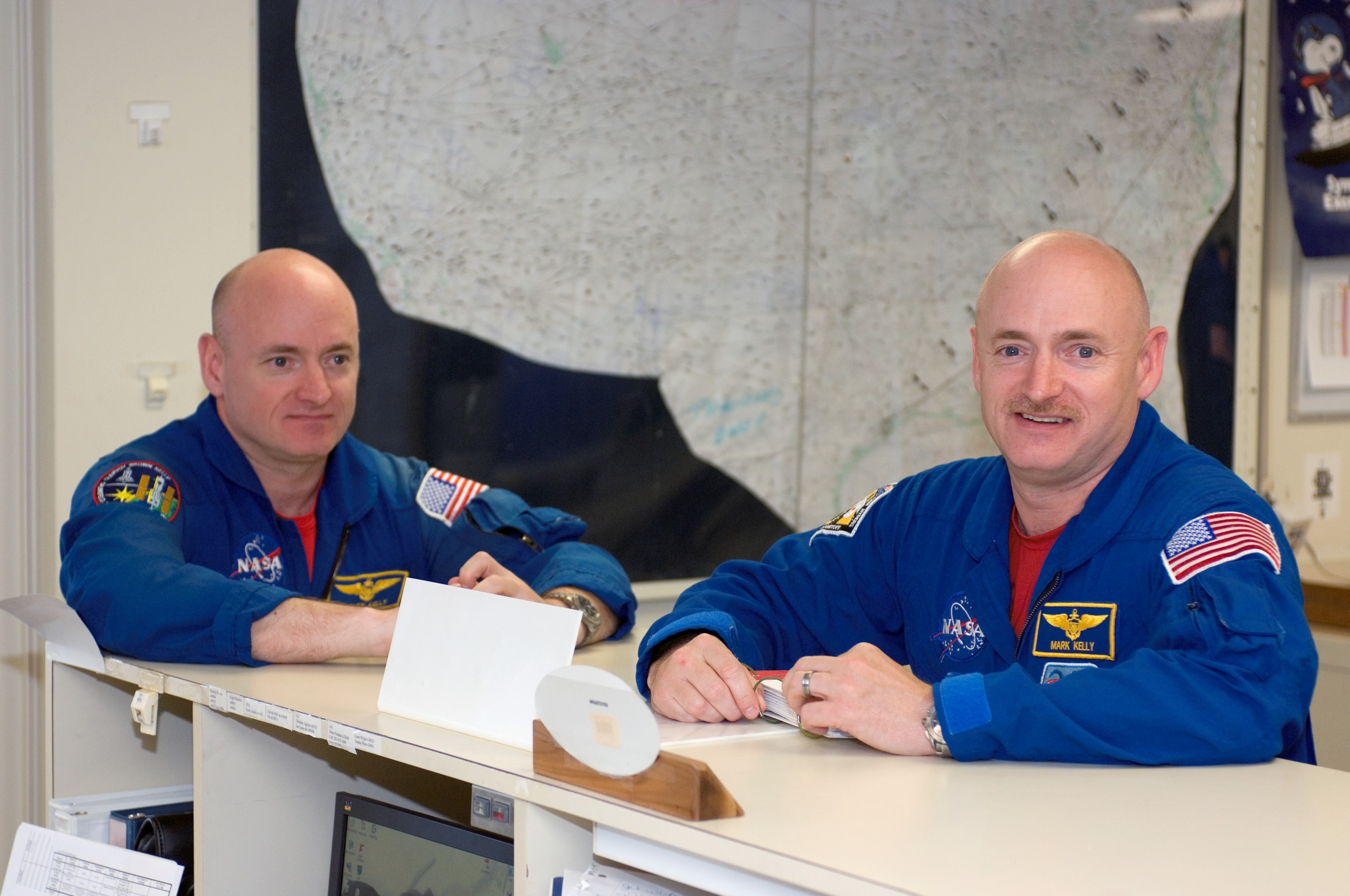 The Kelly brothers - Scott and Mark (left to right) - pose in May 2008. In 2015, both will be test subjects aiding researchers in the study of spaceflight's effects on the human body. Photo Credit: NASA