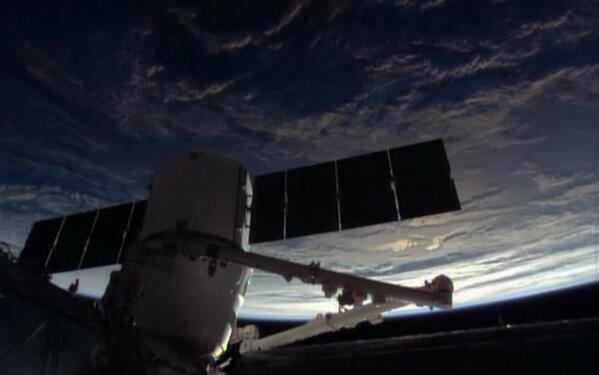 SpaceX's "Easter Dragon" comes knocking at the International Space Station's door with a perfect, on-time berthing on Easter Sunday. Photo Credit: NASA TV