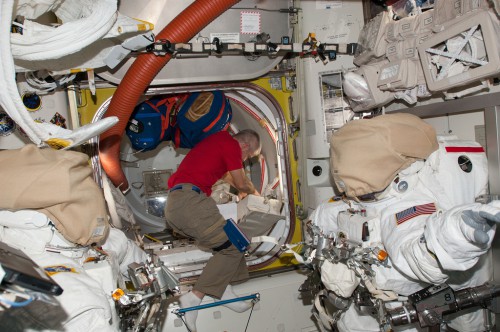 During preparations for his EVA with Rick Mastracchio, Steve Swanson is pictured working inside the Quest airlock. Photo Credit: NASA