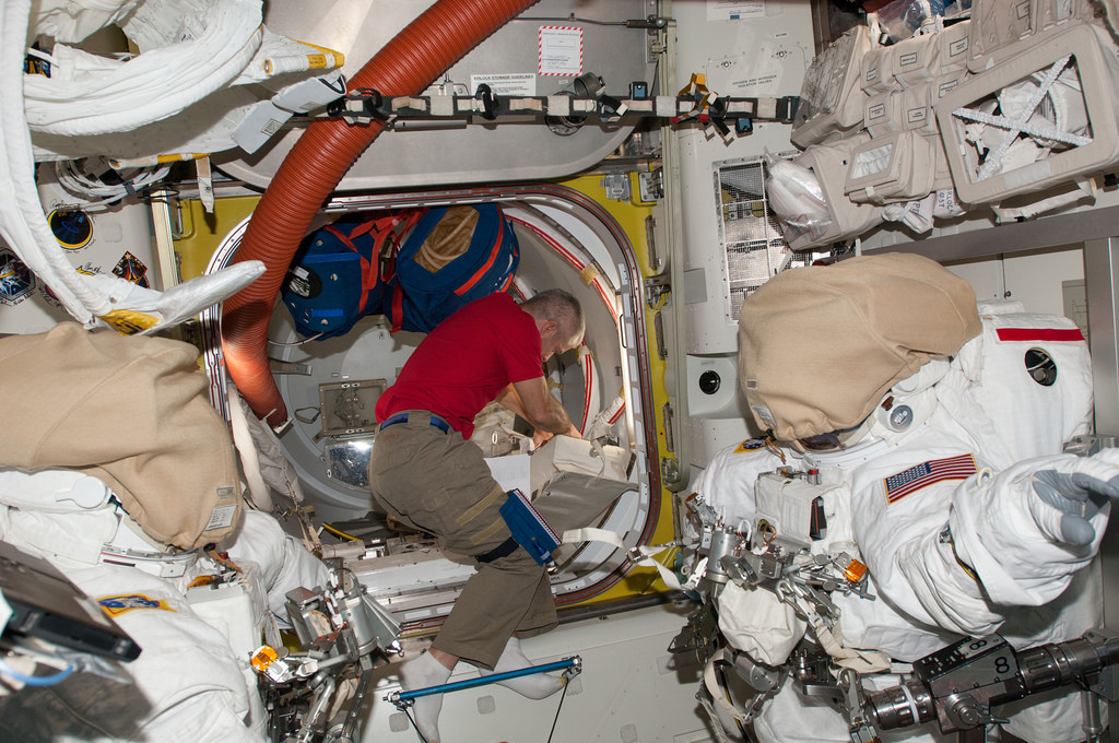 During preparations for EVA-26 on 17 April, Steve Swanson works inside the Quest airlock. Photo Credit: NASA