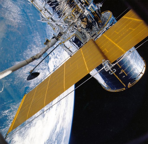 Pictured here during their deployment on STS-31, Hubble's gigantic British Aerospace-built solar arrays would provide critical electrical power for the telescope's systems. Photo Credit: NASA
