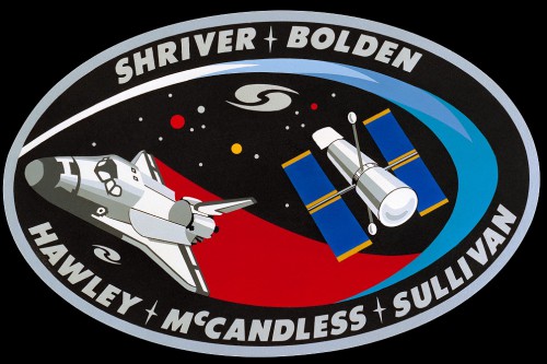 Surrounded by the surnames of the five-member crew, the STS-31 official patch carried all of the symbolism of what would be one of the grandest adventures of discovery in human history. It is an adventure which continues to this day. Image Credit: NASA
