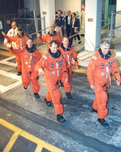 With St. Joseph of Cupertino rooting for them, the crew of STS-59 heads out to the pad on 9 April 1994. Photo Credit: NASA