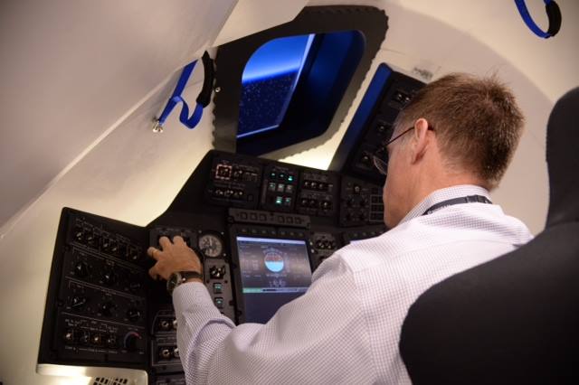 Chris Ferguson, NASA’s last Space Shuttle Atlantis commander, works at consoles testing on-orbit, docking and entry scenarios on the Boeing CST-100 capsule which can fly US astronauts to the International Space Station in 2017. Ferguson is now Boeing’s director of Crew and Mission Operations for the Commercial Crew Program vying for NASA funding. Credit: NASA/Boeing
