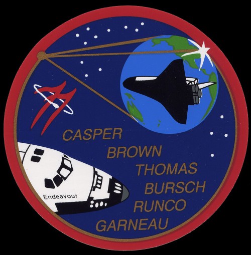 The circular expanse of the Inflatable Antenna Experiment (IAE) is juxtaposed over Earth in the STS-77 crew's official patch. Image Credit: NASA, via Joachim Becker/SpaceFacts.de