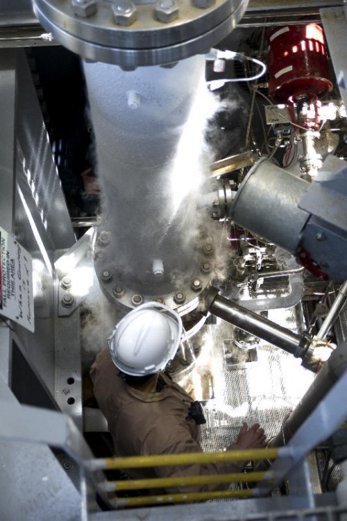 A member of the A-1 Test Stand operations team examines the progress of a cold-shock test on the new A-1 structural piping system May 1. The test marked a milestone in preparing the stand to test the RS-25 rocket engines that will power the core stage of NASA’s new Space Launch System. Delivery and installation of the first RS-25 engine is planned for early summer. Photo Credit: NASA/Stennis