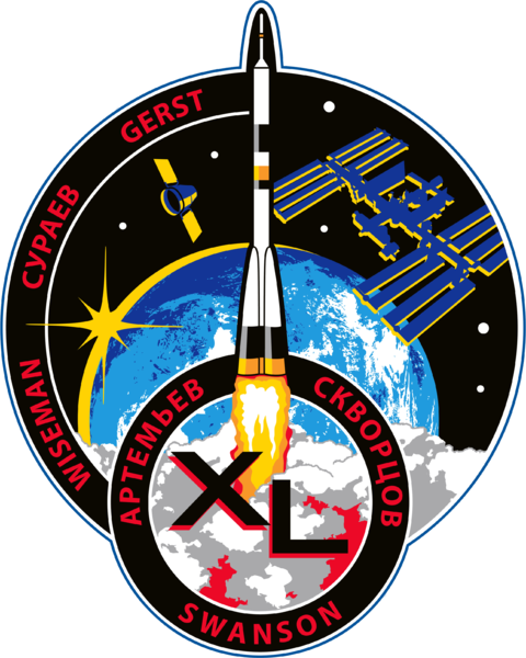 The Expedition 40 patch, bearing the names of the six-man crew: Commander Steve Swanson, Russian cosmonauts Aleksandr Skvortsov, Oleg Artemyev and Maksim Surayev, U.S. astronaut Reid Wiseman and Germany's Alexander Gerst. Image Credit: NASA