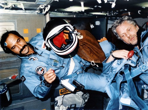 Wubbo Ockels (left) and German astronaut Reinhard Furrer at work aboard Challenger during Mission 61A. Photo Credit: NASA