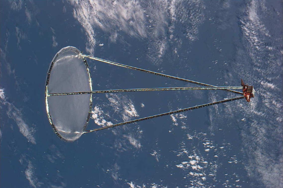 Fully deployed, the Inflatable Antenna Experiment (IAE) sprouts from the SPARTAN-207 satellite. Photo Credit: NASA