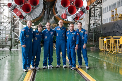 The Soyuz TMA-13M prime and backup crews at the base of the Soyuz-FG booster at Baikonur. From the left are Terry Virts, Samantha Cristoforetti, Anton Shkaplerov, Alexander Gerst, Maksim Surayev and Reid Wiseman. Photo Credit: NASA