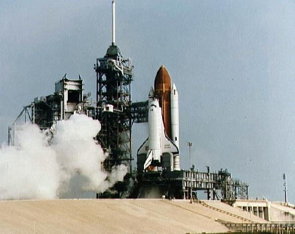 An ominous cloud of smoke billows away from Pad 39A in the seconds after a problematic Main Engine Start. Photo Credit: NASA 