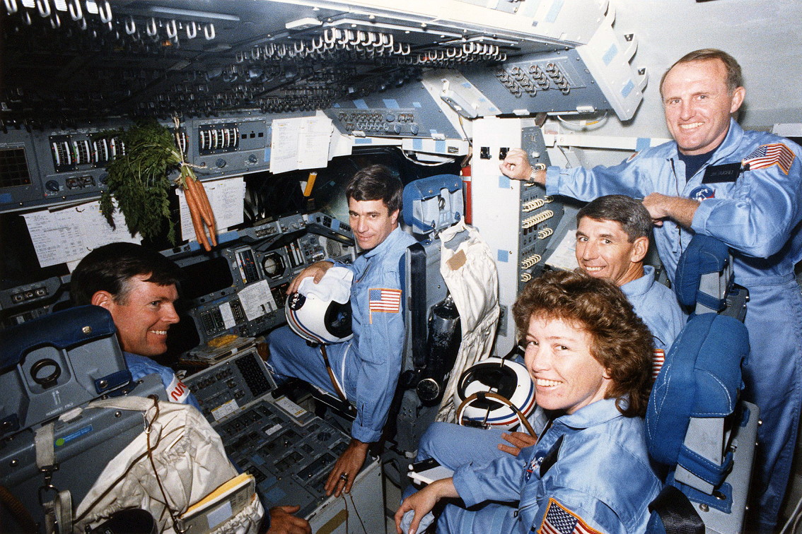 The "core" NASA crew of the former Mission 61H, pictured during one of their post-Challenger extended simulations. From left to right are Mike Coats, John Blaha, Anna Fisher, Bob Springer and (standing) Jim Buchli. Photo Credit: NASA/Joachim Becker/SpaceFacts.de