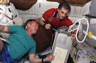 When Andy Thomas (left) was assigned to serve as backup to Dave Wolf (right) in January 1997, he anticipated that it would be a "non-flying" role. Little could either man have guessed that they would end up together in space just 12 months later. Photo Credit: NASA