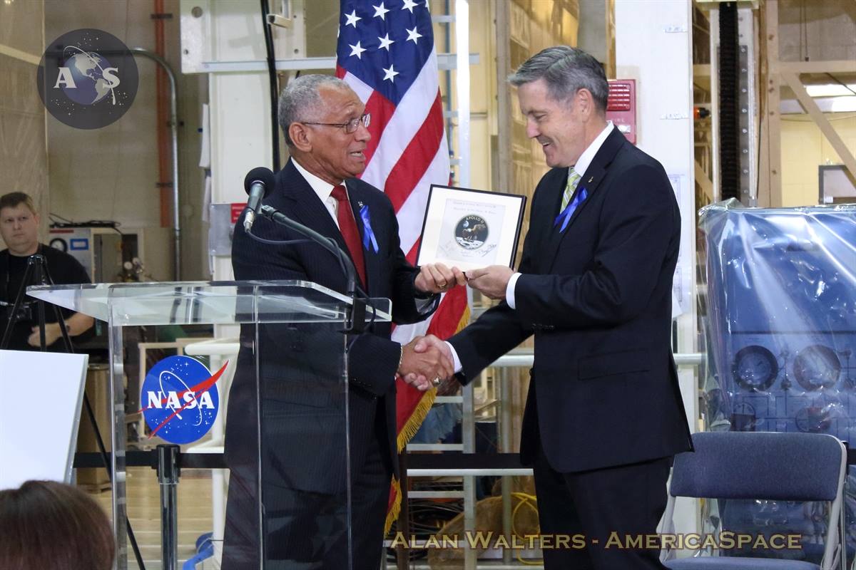 NASA Administrator Charlie Bolden presents Kennedy Space Center (KSC) Director Bob Cabana with a flown Apollo 11 patch. Someday, this patch will be flown on the first manned Mars mission, to be helmed by NASA's Orion spacecraft. Photo Credit: Alan Walters/AmericaSpace