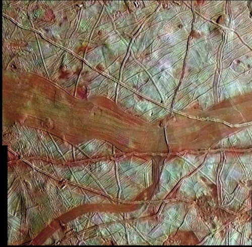 A newly-released reprocessed image of Europa's surface from the old Galileo mission, showing the prominent reddish bands and cracks. Image Credit: NASA/JPL-Caltech