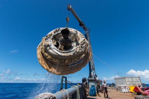 From NASA: "Hours after the June 28, 2014, test of NASA's Low-Density Supersonic Decelerator over the U.S. Navy's Pacific Missile Range, the saucer-shaped test vehicle is lifted aboard the Kahana recovery vessel. " Photo Credit: NASA/JPL-Caltech