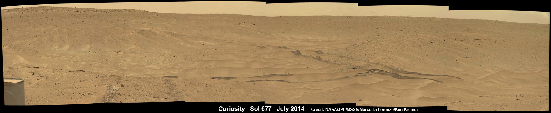 Curiosity cross windblown ripples on Mars on the traverse to Mount Sharp in this photo mosaic view captured on July 1, 2014, Sol 677. Mastcam raw images from Sol 677 stitched. Credit: NASA/JPL-Caltech/MSSS/Marco Di Lorenzo/Ken Kremer – kenkremer.com