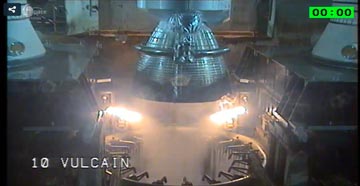 At T-0, the French-built Vulcain-2 engine of the first stage roared to life. It underwent 7.5 seconds of computer-controlled health checks, ahead of the command to fire the two side-mounted, solid-fueled boosters. Photo Credit: Arianespace, with thanks to Mike Barrett