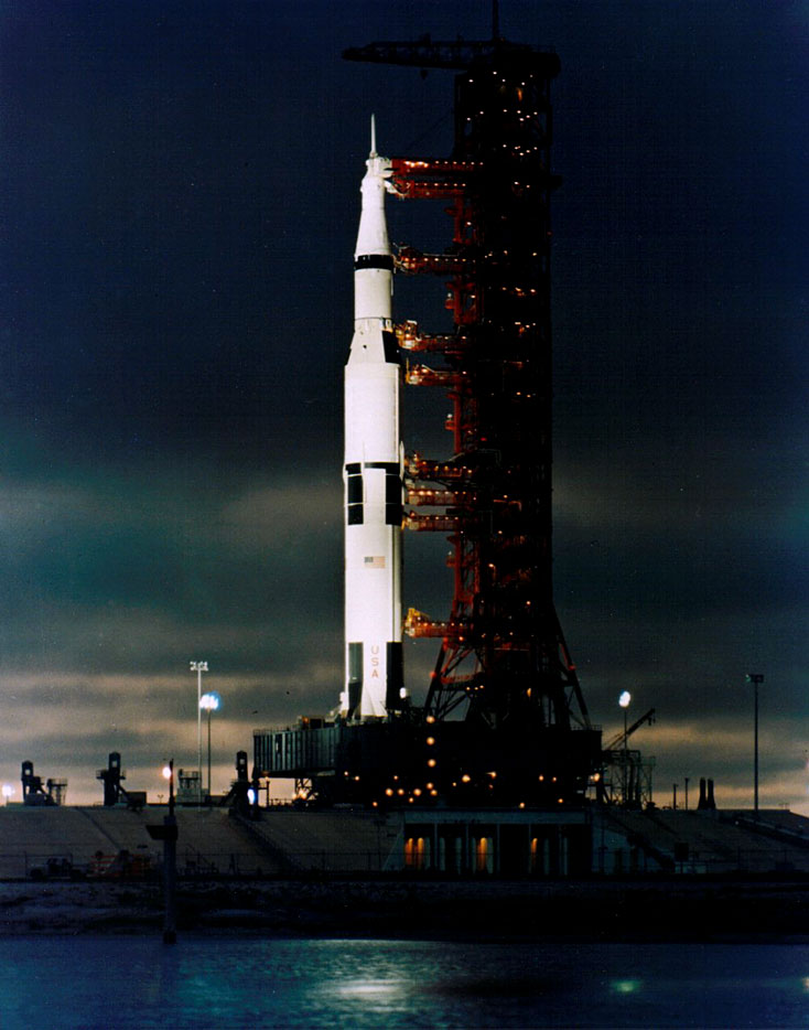 Like a bright ladder reaching the heavens, the Apollo 11 Saturn V is bathed in spotlight on launchpad 39A. Forty-five years ago this week, the first humans climbed it to the Moon.