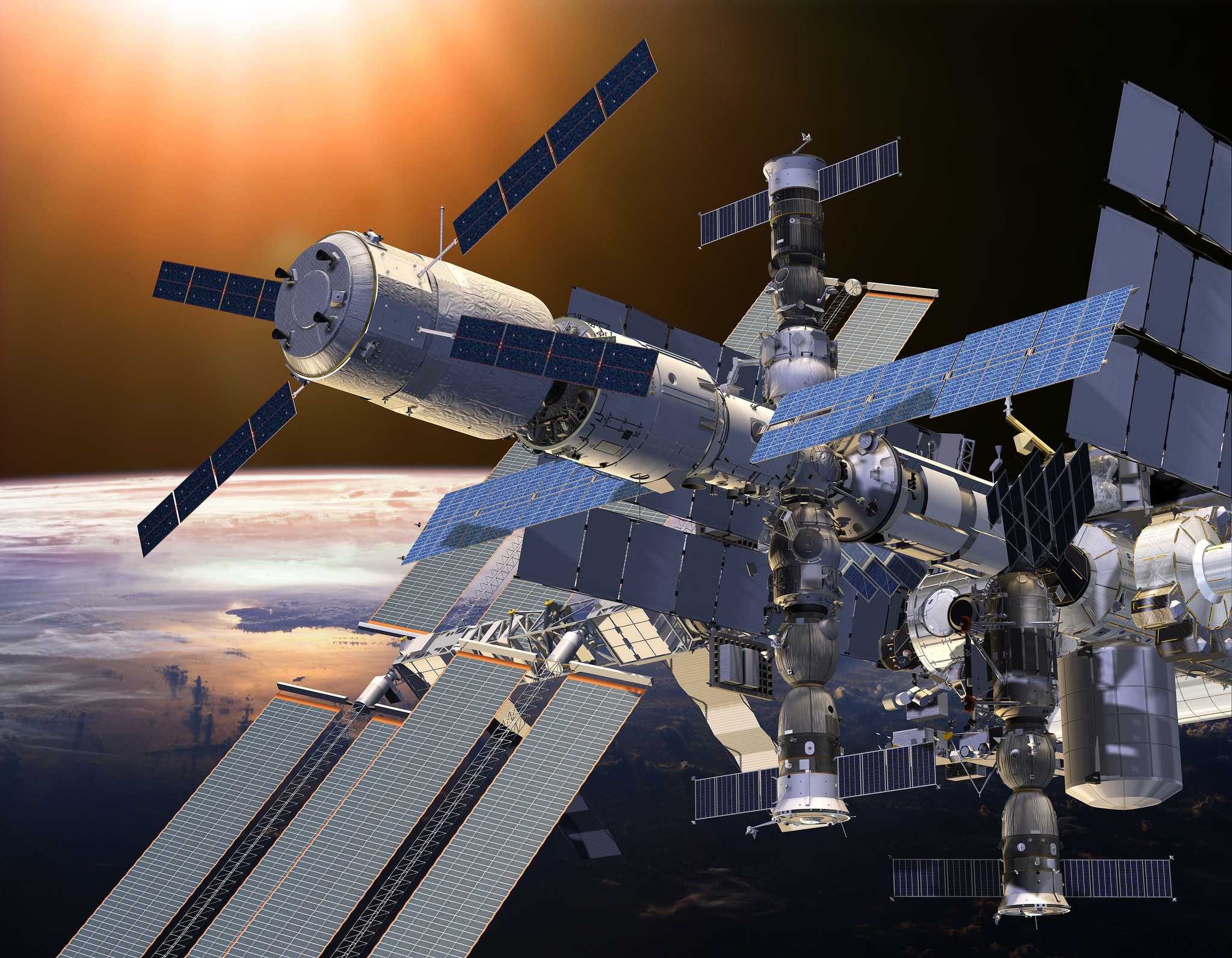 Artist's view of the International Space Station (ISS), with the Automated Transfer Vehicle (ATV) clearly demarcated by the presence of its "windmill" of four solar arrays at the upper left. Image Credit: ESA 