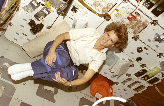 Eileen Collins, the first female spacecraft commander in history, floats in Columbia's middeck, 15 years ago this week. Photo Credit: NASA