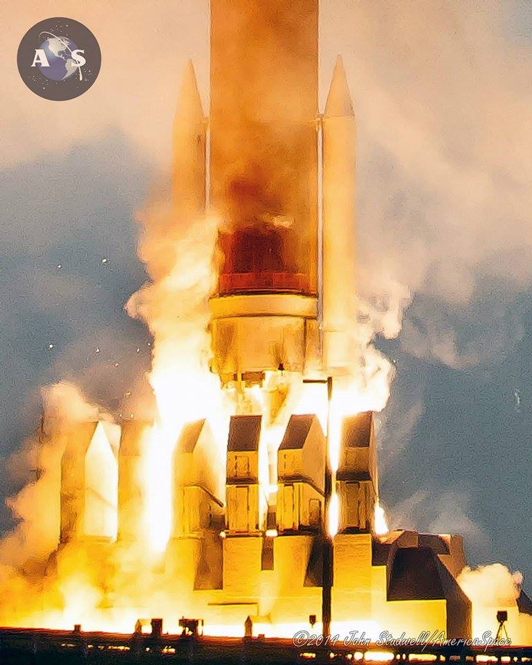 Breathing fire and smoke, the Delta IV lifts off. Photo Credit: John Studwell/AmericaSpace