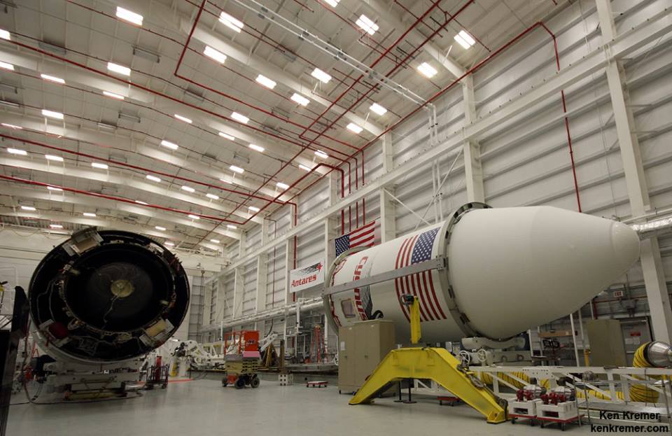 Impressive view of the Antares vehicle (left) and the ORB-2 Cygnus, encapsulated within its bulbous payload shroud, pictured in the Horizontal Integration Facility (HIF) at Wallops. Photo Credit: Ken Kremer