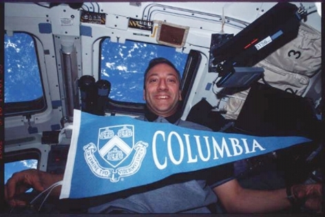 NASA Astronauy Mike Massimino in the space shuttle Columbia during his first mission to repair the Hubble  Space Telescope in March 2002. Massimino is returning to his Alma mater, Columbia University, for a full time position. Photo Credit: NASA