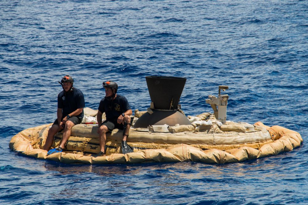 From NASA: "MACH 4 TO PACIFIC: Two members of the Navy's Explosive Ordinance Disposal team perch on the test vehicle used in the first flight of NASA's Low-density Supersonic Decelerator project. The test vehicle was fished out of the waters of the U.S. Navy's Pacific Missile Range within hours of splashdown. During the June 28, 2014, engineering flight, the saucer-shaped test vehicle climbed to over 180,000 feet (about 55,000 meters) in altitude and went as fast as four times the speed of sound." Photo Credit: NASA/JPL-Caltech