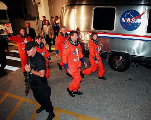 Led by commander Eileen Collins, the STS-93 crew emerges into the glare of television lights on the night of 22 July 1999. Photo Credit: Joachim Becker/SpaceFacts.de