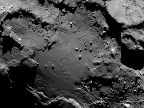 From the ESA: "Stunning close up detail focusing on a smooth region on the ‘base’ of the ‘body’ section of comet 67P/Churyumov-Gerasimenko. The image was taken by Rosetta’s OSIRIS narrow-angle camera and downloaded today, 6 August. The image clearly shows a range of features, including boulders, craters and steep cliffs.  The image was taken from a distance of 130 km and the image resolution is 2.4 metres per pixel." Image Credit: ESA/Rosetta/MPS for OSIRIS Team MPS/UPD/LAM/IAA/SSO/INTA/UPM/DASP/IDA