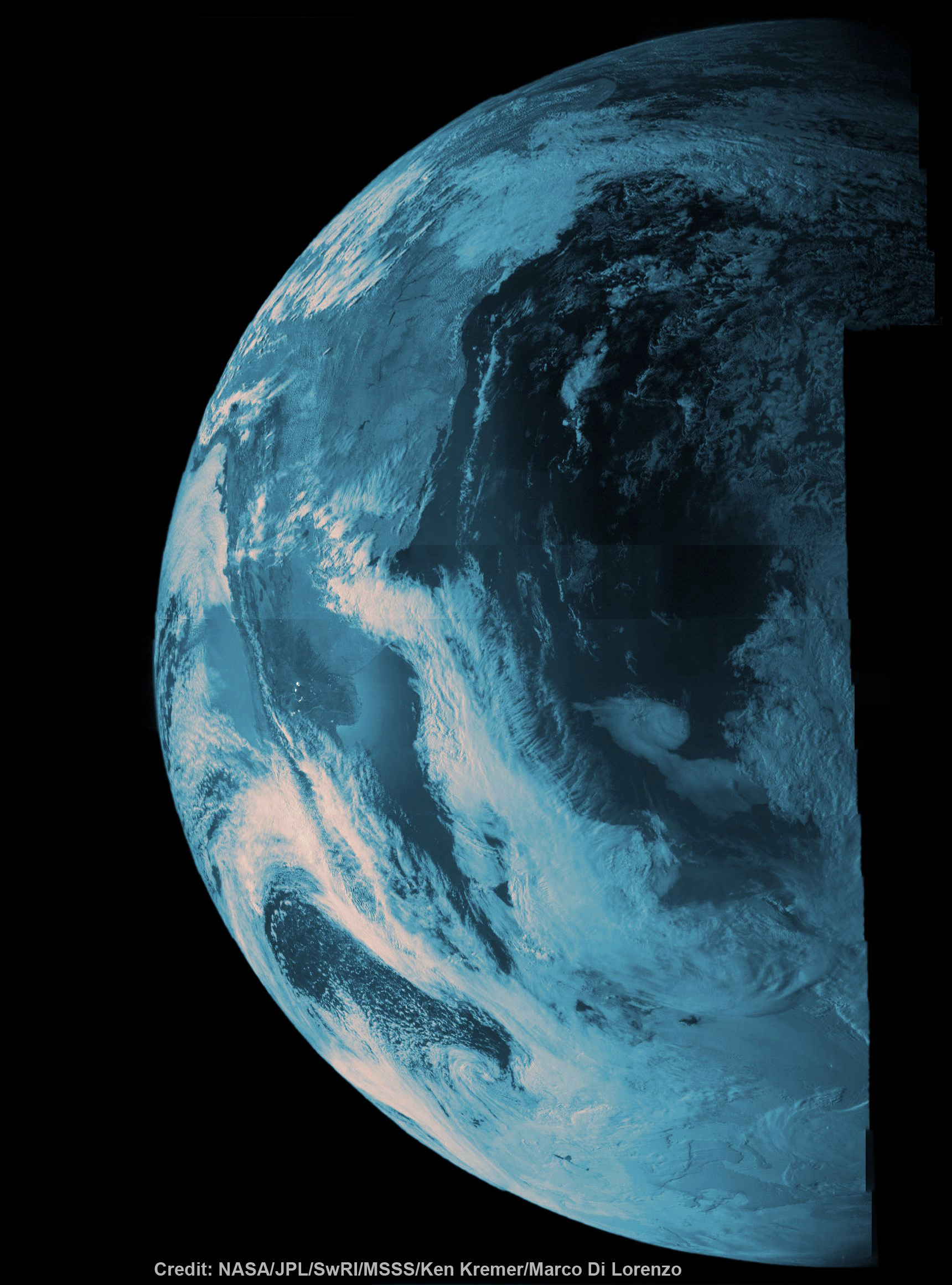 NASA’s Juno probe captured the image data for this composite picture during its Earth flyby on Oct. 9, 2013 over Argentina, South America and the southern Atlantic Ocean. Raw imagery was reconstructed and aligned by Ken Kremer and Marco Di Lorenzo, and false-color blue has been added to the view taken by a near-infrared filter that is typically used to detect methane. Credit: NASA/JPL/SwRI/MSSS/Ken Kremer/Marco Di Lorenzo