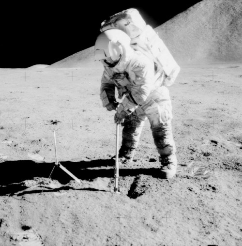 Jim Irwin works on digging a trench to test the bearing capacity of the lunar soil. He "solved a dog's job with a dog's technique". Photo Credit: NASA