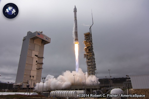 Powered by its Russian-built RD-180 engine, the Atlas V begins a slow climb away from Space Launch Complex (SLC)-3E. Photo Credit: Robert C. Fisher/AmericaSpace