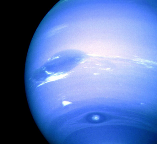 The Great Dark Spot and Bright Companion, together with the chevron-like "Scooter" and D-2 are visible in this Voyager 2 image of Neptune. Photo Credit: NASA