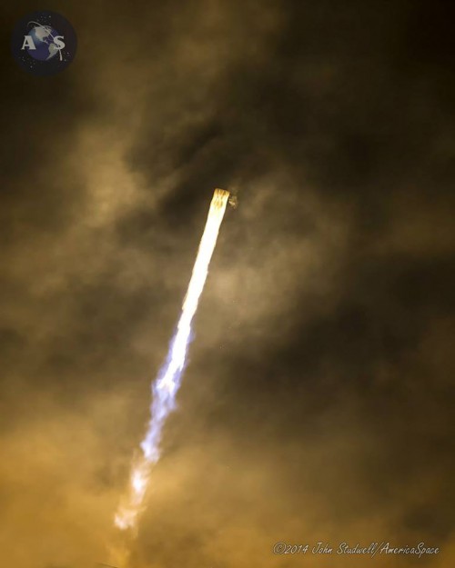The Falcon 9 punches into the darkened Florida sky. Photo Credit: John Studwell/AmericaSpace
