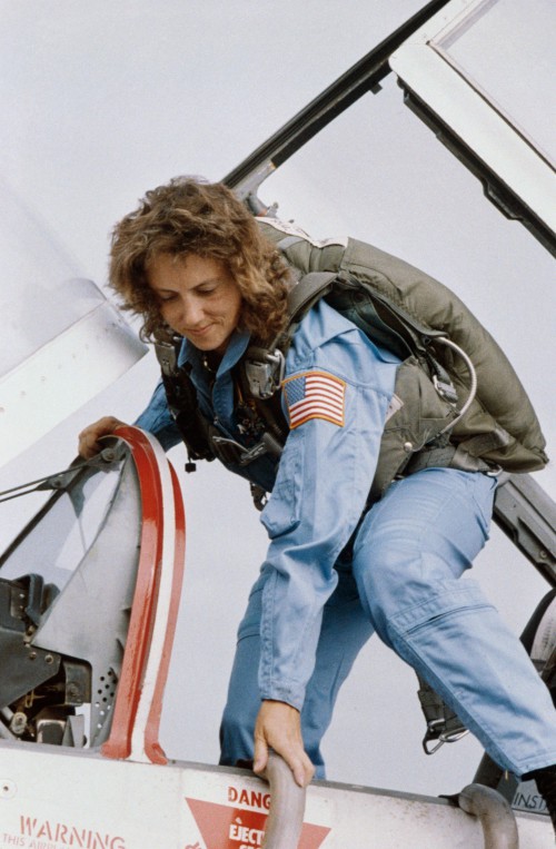 Christa McAuliffe disembarks from a T-38 jet trainer at Ellington Field, near Houston, during pre-flight training. Photo Credit: NASA