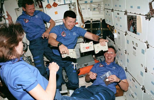 Four of the five STS-37 crewmates enjoy a light moment in Atlantis' middeck. From left to right are Linda Godwin, Steve Nagel, Ken Cameron and Jerry Ross. Photo Credit: NASA, via Joachim Becker/SpaceFacts.de