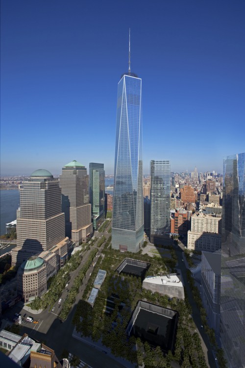 One World Trade Center, formerly Freedom Tower, stands tall next to the memorial pools reflection pools which mark the footprints of the original twin towers. Photo Credit: The Durst Organization/Port Authority of New York & New Jersey/Miller Hare