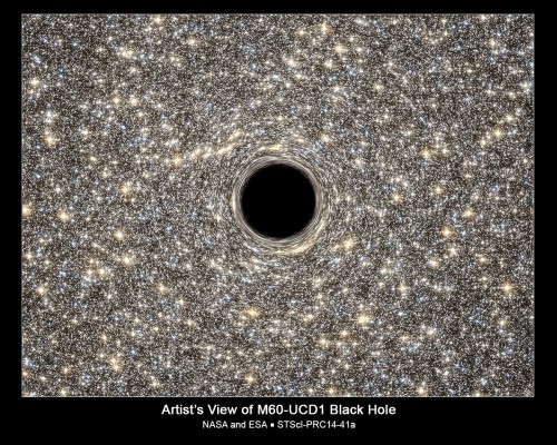 Artist's concept of the massive black hole in the dwarf galaxy M60-UCD1. Image Credit: NASA, ESA, STScI-RCC14-41a