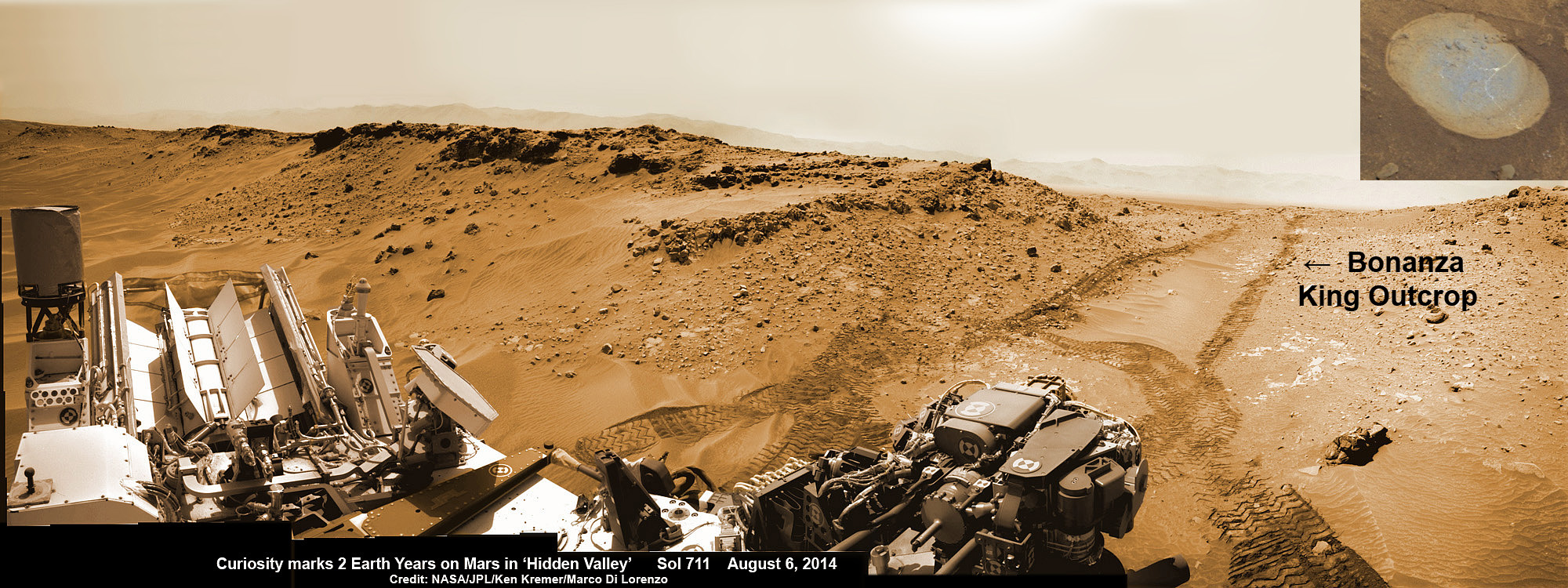 NASA’s Curiosity rover looks back to ramp with abandoned 4th drill site target at ‘Bonanza King’ rock outcrop in ‘Hidden Valley’ in this photo mosaic view captured on Aug. 6, 2014, Sol 711.  Inset shows results of brushing on Aug. 17, Sol 722 that revealed gray patch beneath red dust.  Note the rover’s partial selfie, valley walls, deep wheel tracks in the sand dunes and distant rim of Gale crater beyond the ramp. Navcam camera raw images stitched and colorized.  Credit: NASA/JPL-Caltech/Ken Kremer-kenkremer.com/Marco Di Lorenzo