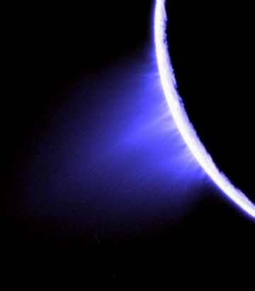 A false-color view of water plumes extending over the surface of Enceladus, as imaged by Cassini in 2005, from a distance of approximately 148,000 kilometers. Image Credit: NASA/JPL/Space Science Institute 