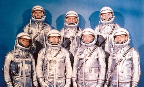 The famous image of the Mercury Seven, clad in their silver pressure suits, with Deke Slayton standing, second from the left. Photo Credit: NASA