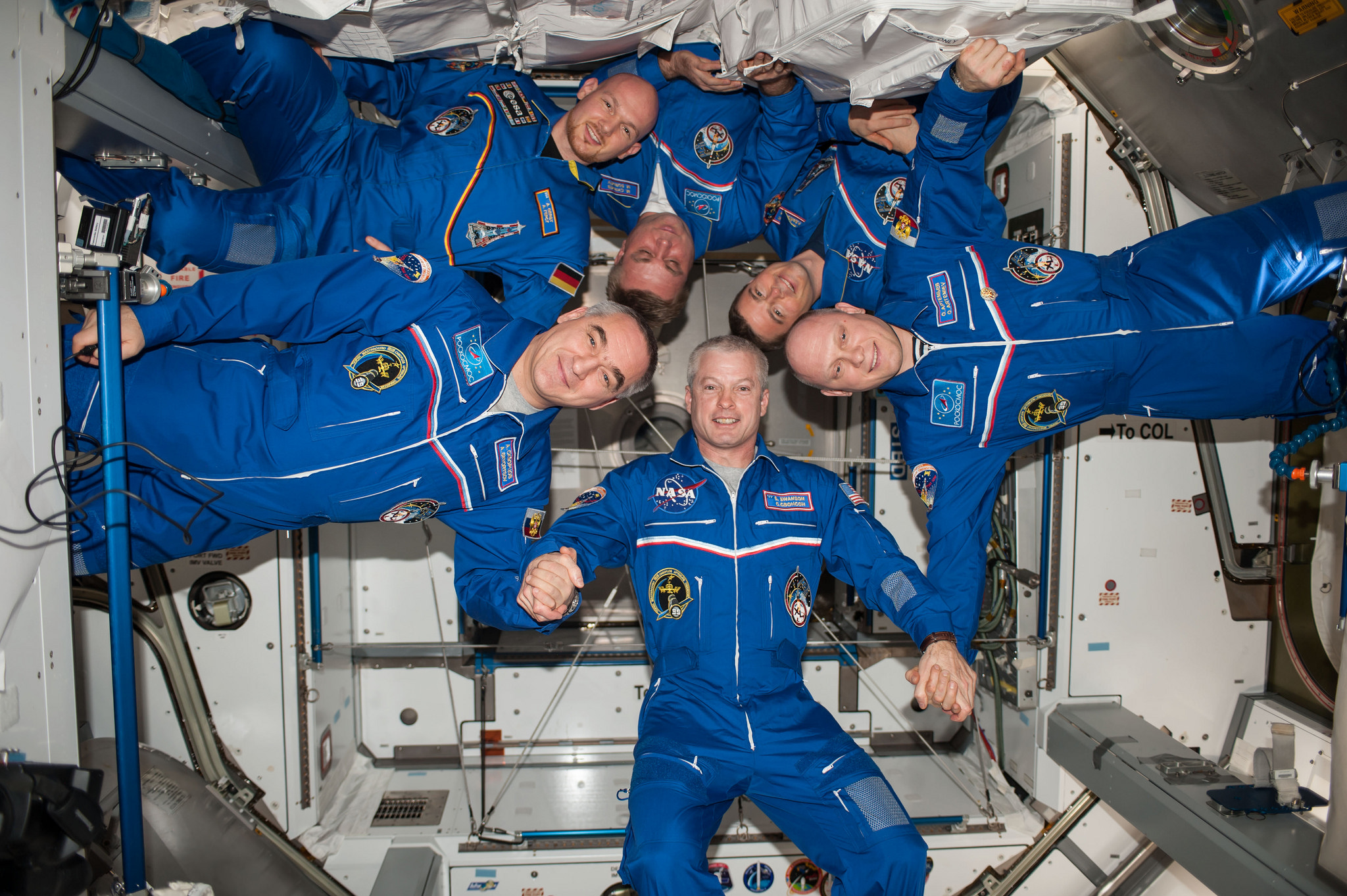 The Expedition 40 crew. Clockwise from bottom center are Steve Swanson, Aleksandr Skvortsov, Alexander Gerst, Maksim Surayev, Reid Wiseman and Oleg Artemyev. Photo Credit: NASA