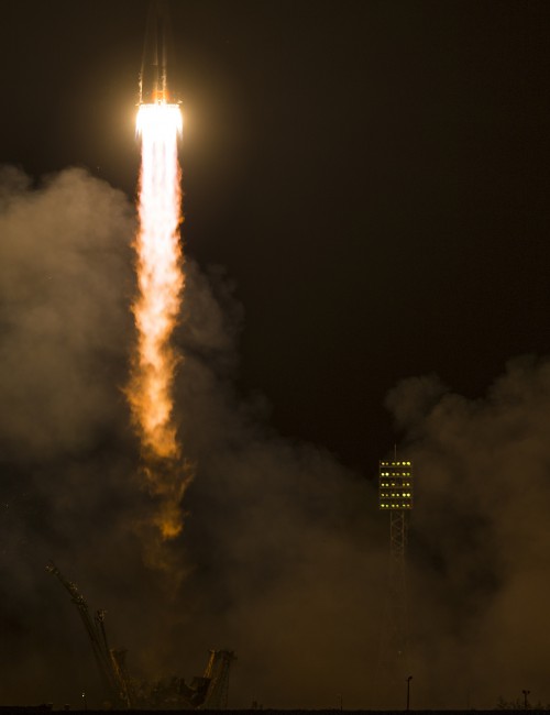 Powered uphill by its central core stage and four tapering boosters, Soyuz TMA-14M delivered Russian cosmonauts Aleksandr Samokutyayev and Yelena Serova, together with U.S. astronaut Barry Wilmore, into orbit. Photo Credit: NASA