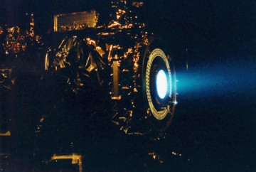 The 2.3 kW NSTAR ion thruster for the Deep Space 1 spacecraft, during a hot fire test in a vacuum chamber at NASA's Jet Propulsion Laboratory. Dawn uses a similar propulsion system. Image Credit: NASA/JPL