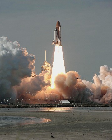 Mission 51C roars into orbit on 24 January 1985, kicking off Loren Shriver's first shuttle flight. Photo Credit: NASA