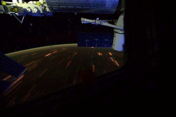 "That little red streak, hidden behind the #Dragon solar array is the Soyuz launching." A remarkable image of the Soyuz TMA-14M ascent, captured and tweeted by Expedition 41 astronaut Reid Wiseman. Photo Credit: NASA/Reid Wiseman